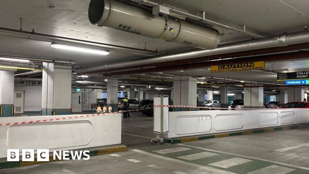 Toddler dies after being struck by car in underground car park - BBC
