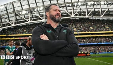 Andy Farrell stands with his arms folded inside Aviva Stadium, wearing an Ireland team fleece top