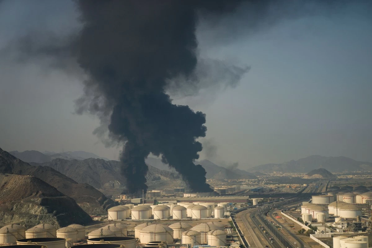 Fire and plumes of smoke rise from an oil facility in Fujairah, United Arab Emirates, Saturday, March 14, 2026. (AP Photo/Altaf Qadri)