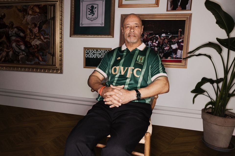 Ireland legend Paul McGrath in a green Villa jersey