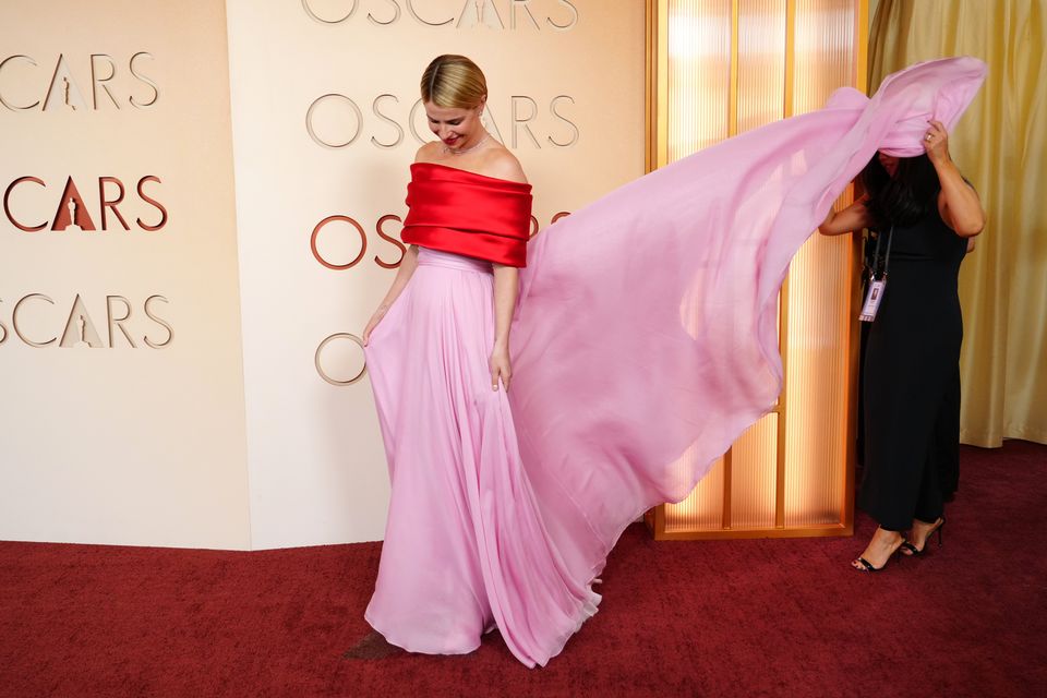 Best actress nominee Jessie Buckley opted for red and pink Chanel for her red carpet appearance(Photo by Jordan Strauss/Invision/AP)