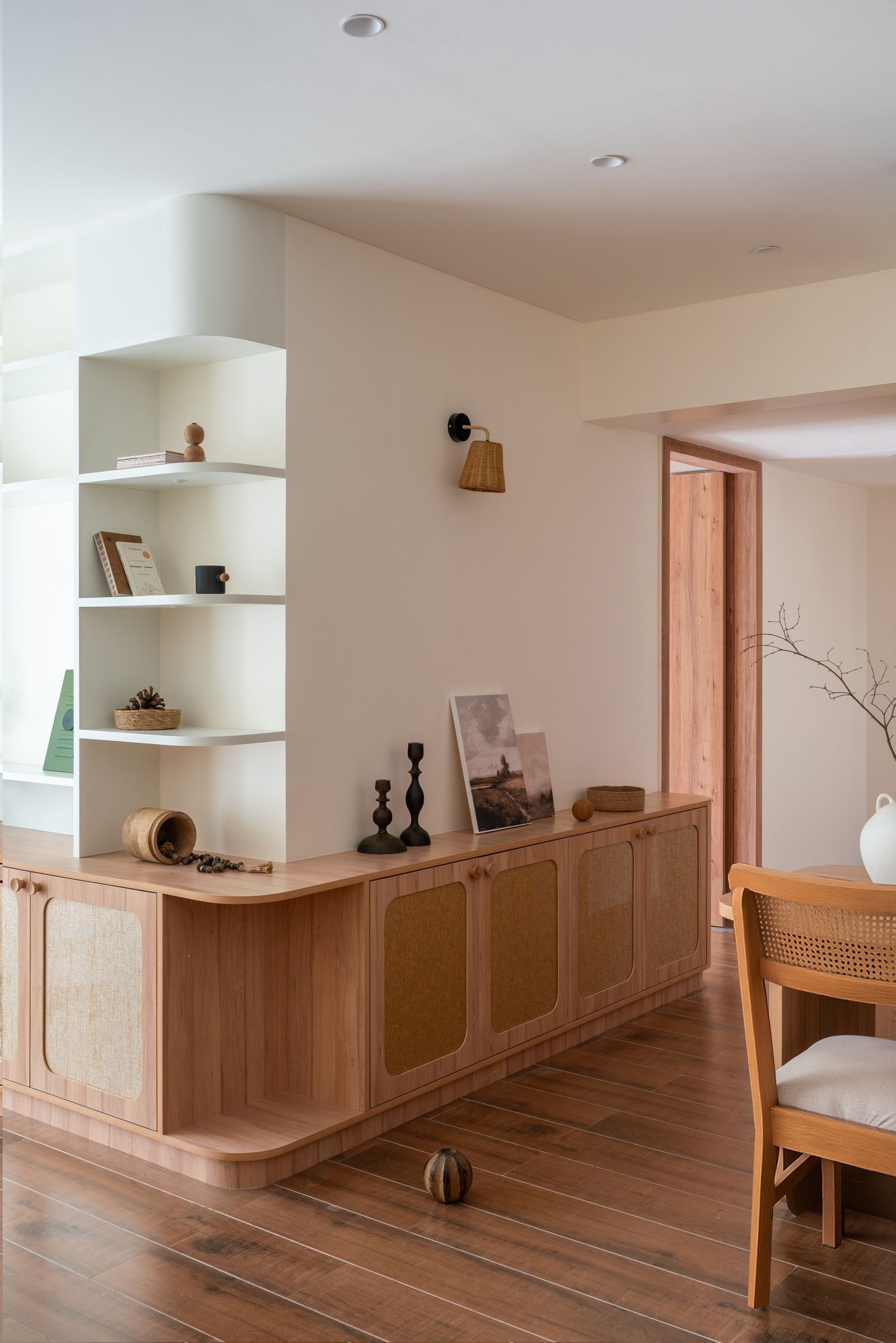 Image may contain Corner Indoors Interior Design Chair Furniture Wood Sideboard Table Lamp Plant and Architecture