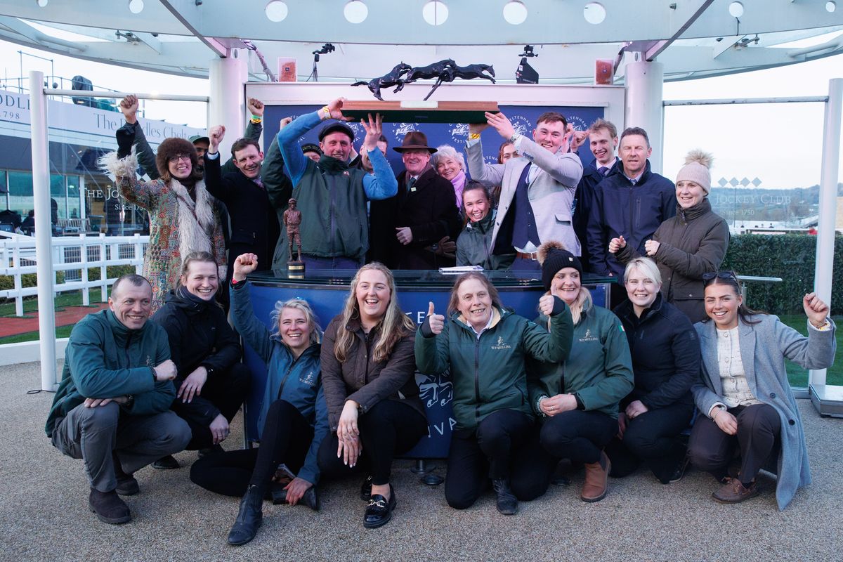 Trainer Willie Mullins and his family, jockeys and yard staff celebrate with the 2026 Cheltenham Festival Leading Trainer trophy at the end of the festival