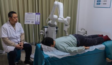 An elderly resident receives a massage from a robot under the supervision of a caregiver in a smart elderly care center in Beijing on March 18, 2025. Photo: Li Hao/GT