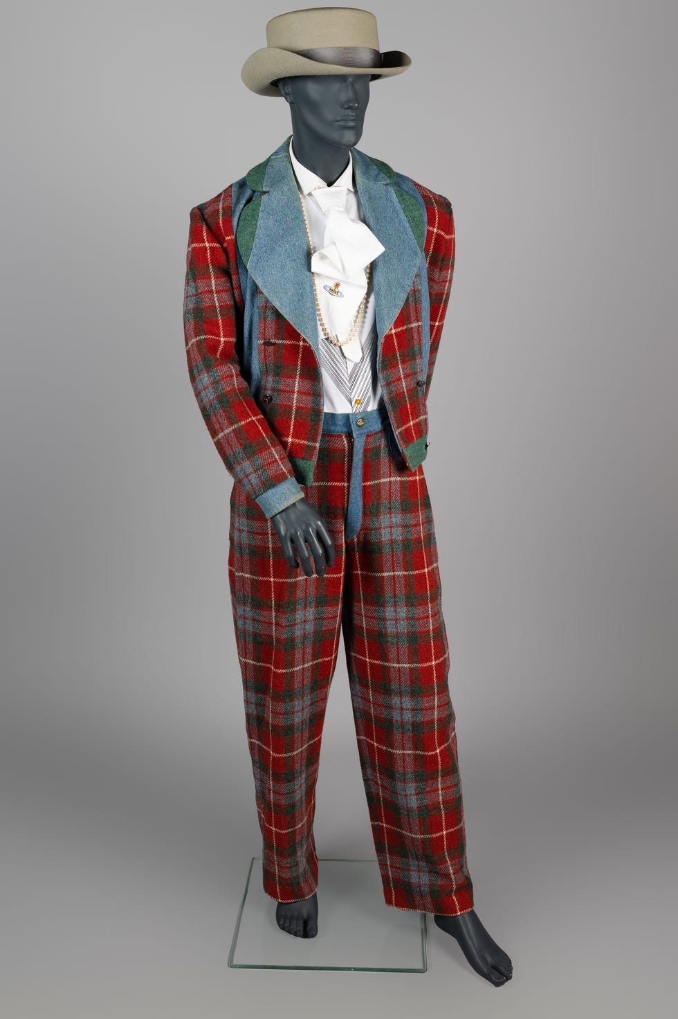 mannequin dressed in a stylish plaid suit with a widebrimmed hat