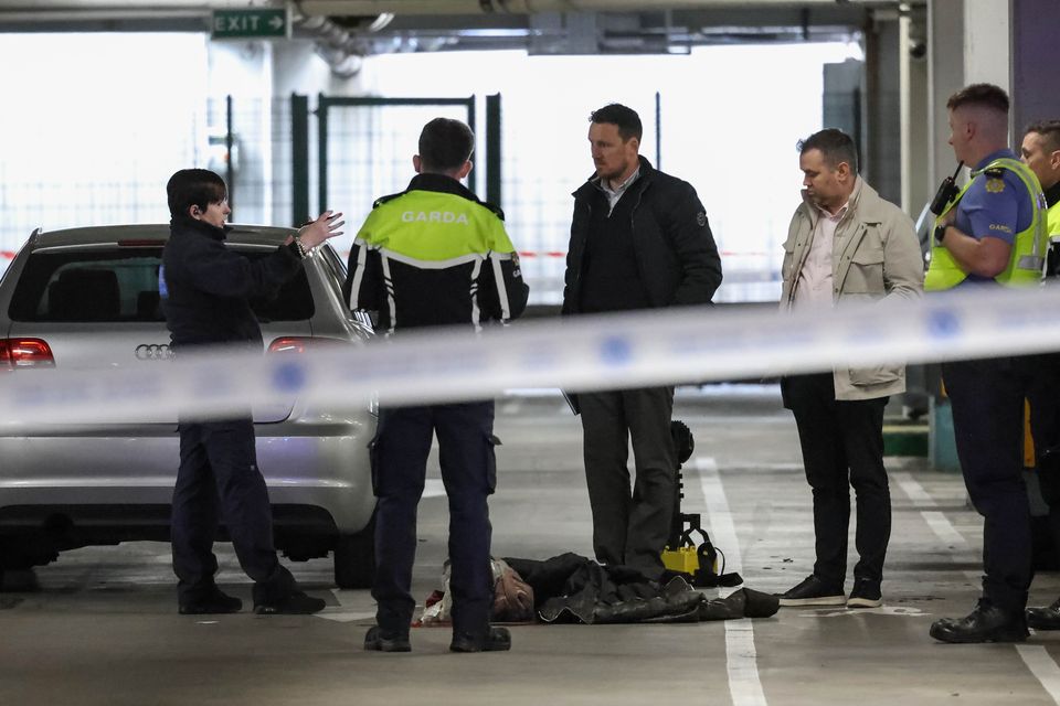 Gardaí at the scene at Charlestown Shopping Centre, Finglas, where a child died after being struck by a car. Photo: Collins