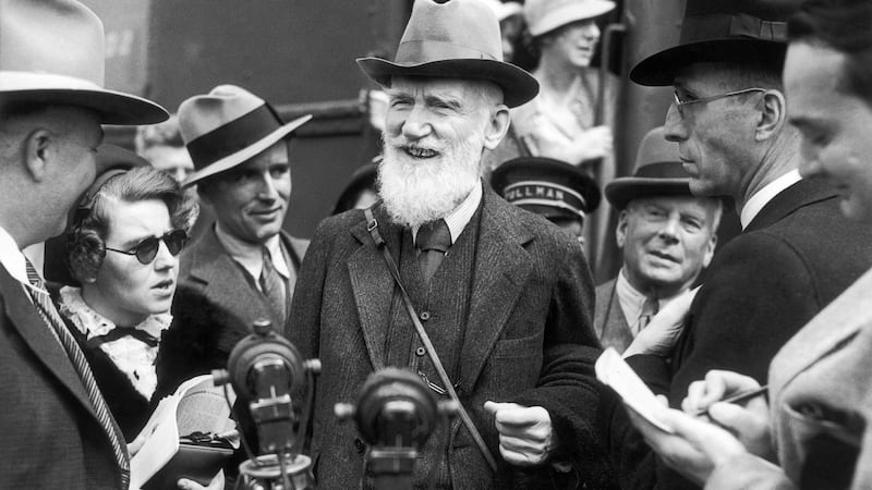 George Bernard Shaw on a visit in Los Angeles answering questions from the American journalists around him. Photograph:  Keystone-France/Gamma-Keystone via Getty Images