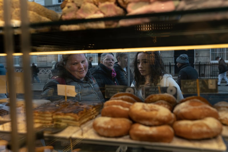 Customers look through the window at Ella’s Heaven on Talbot Street in Dublin