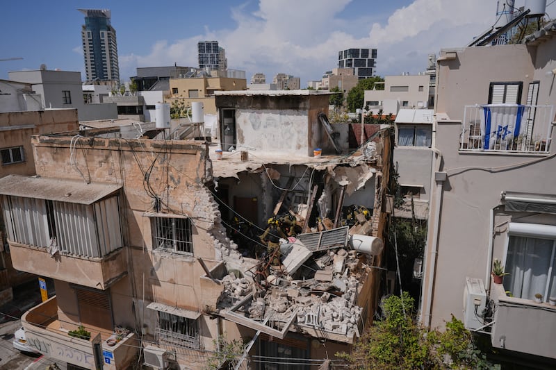 Israeli officials inspect an apartment building struck by an Iranian missile in Tel Aviv, Israel on Sunday. Photograph: Maya Levin/AP