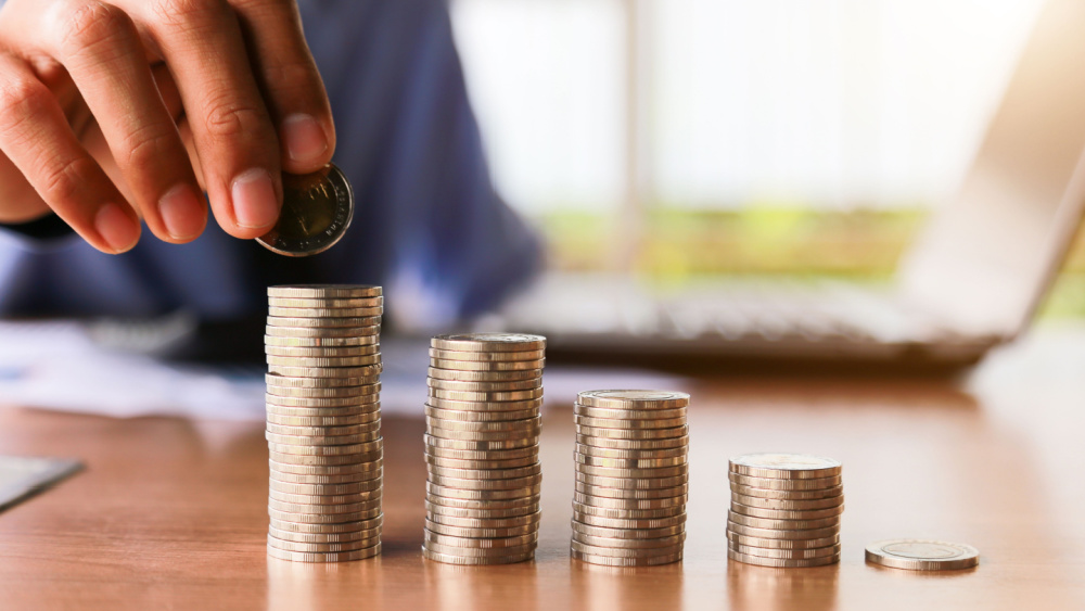 a person pilling euro coins