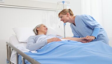 Physiotherapist supporting a stroke survivor during seated trunk control rehabilitation