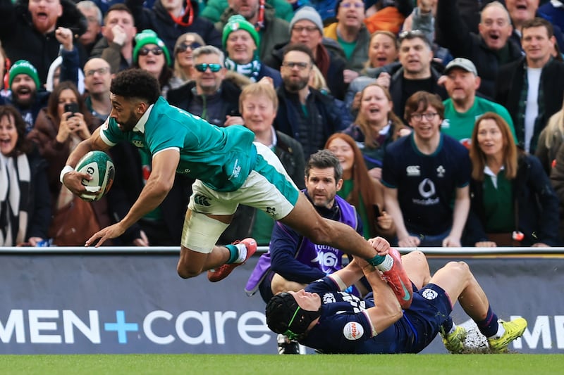 Ireland's Robert Baloucoune dives in to score a try as Scotland's Darcy Graham attempts a tackle during the Six Nations match at the Aviva Stadium. Photograph: Evan Treacy/Getty Images