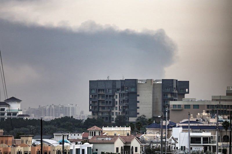 Smoke rises above Dubai on Friday. Explosions rattled buildings in Dubai and a large cloud of smoke hung over a central area of the Middle East financial hub on March 13, AFP correspondents said. Photograph: AFP via Getty Images