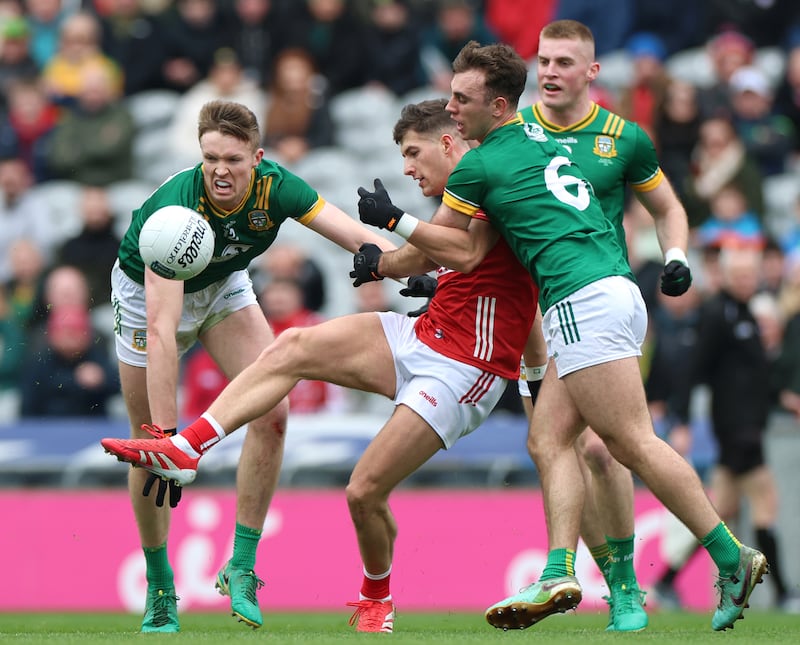 Sean McDonnell passes under pressure in the Cork-Meath Division 2 final. Photograph: James Crombie/Inpho