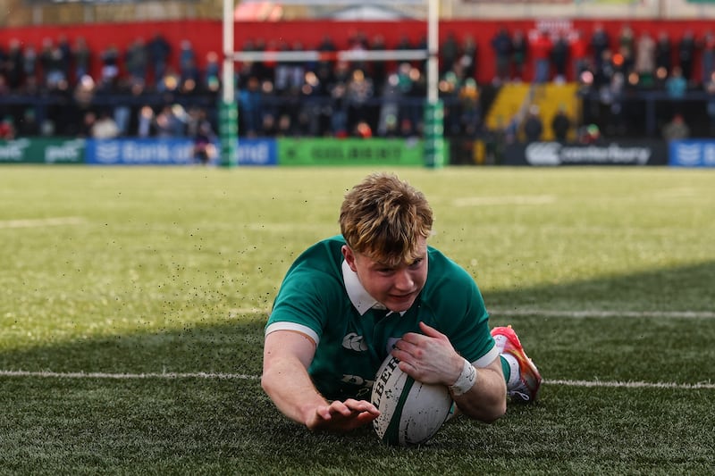 Rob Carney scores Ireland's third try. Photograph: Ben Brady/Inpho