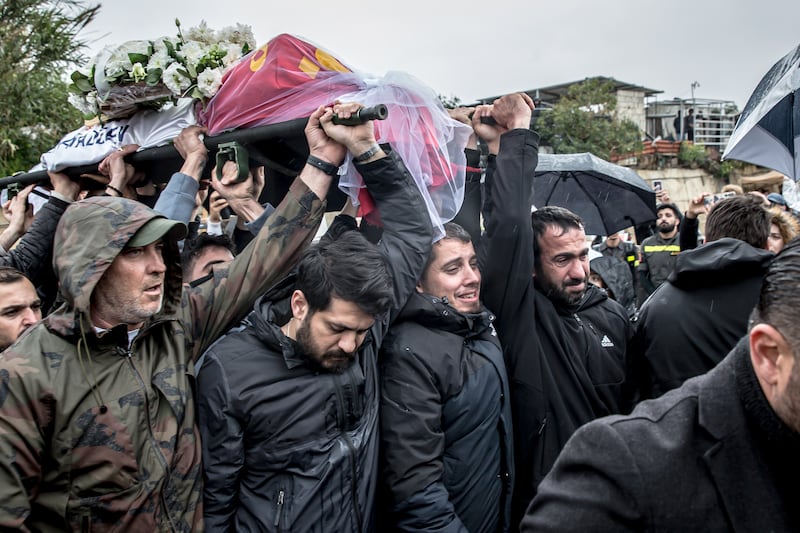 A coffin is carried through a cemetery in Choueifat on Sunday. Photograph: Sally Hayden