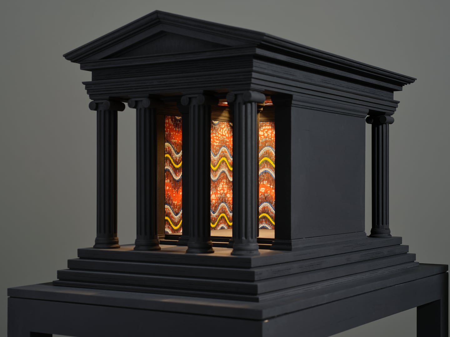 Yinka Shonibare, "Sanctuary City (Temple
of Athena Nike)," 2024. Wood, paint, Dutch wax
printed cotton textile, LED lights. Courtesy of
Tia Collection. Courtesy of the artist and
Goodman Gallery, Cape Town, Johannesburg. ©
Yinka Shonibare CBE. All rights reserved,
DACS 2025.