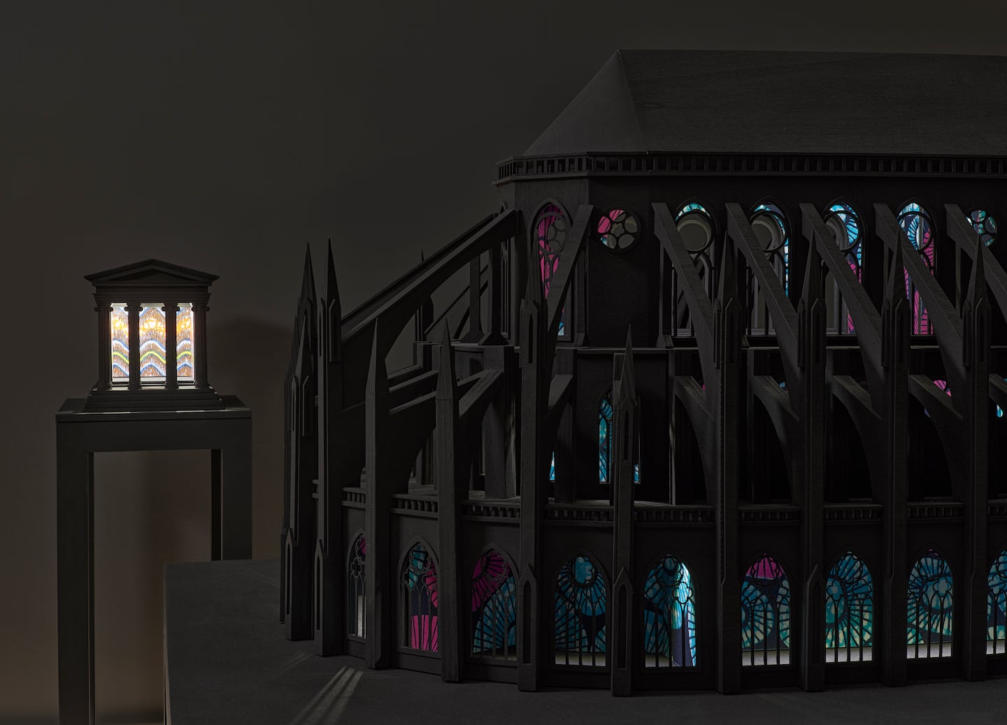 Installation view, "Yinka Shonibare: Sanctuary," Rose Art Museum. Seen here are scale models of the Temple of Athena in Athens (left) and Notre Dame de Paris (right). 