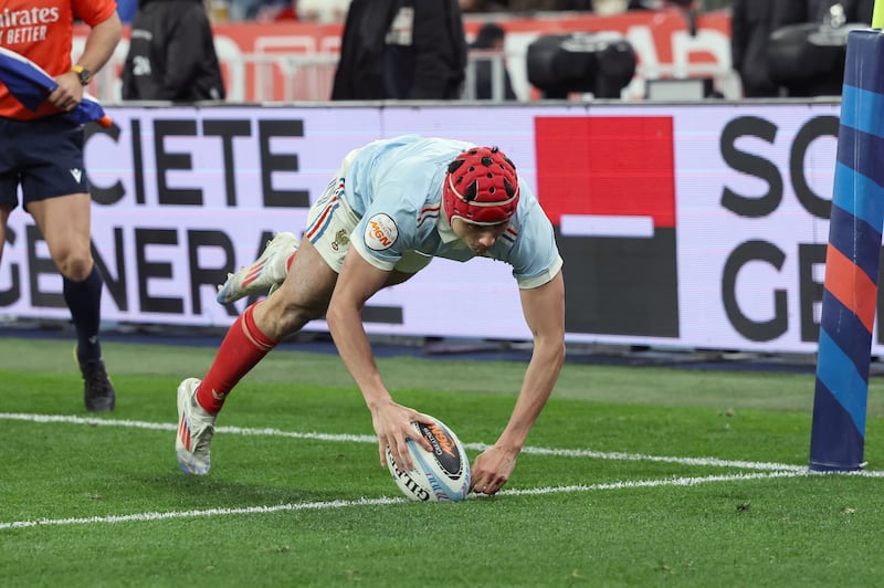 France left wing Louis Bielle-Biarrey scores one of his four tries in the game against England at Stade de France. Photograph: Billy Stickland/Inpho