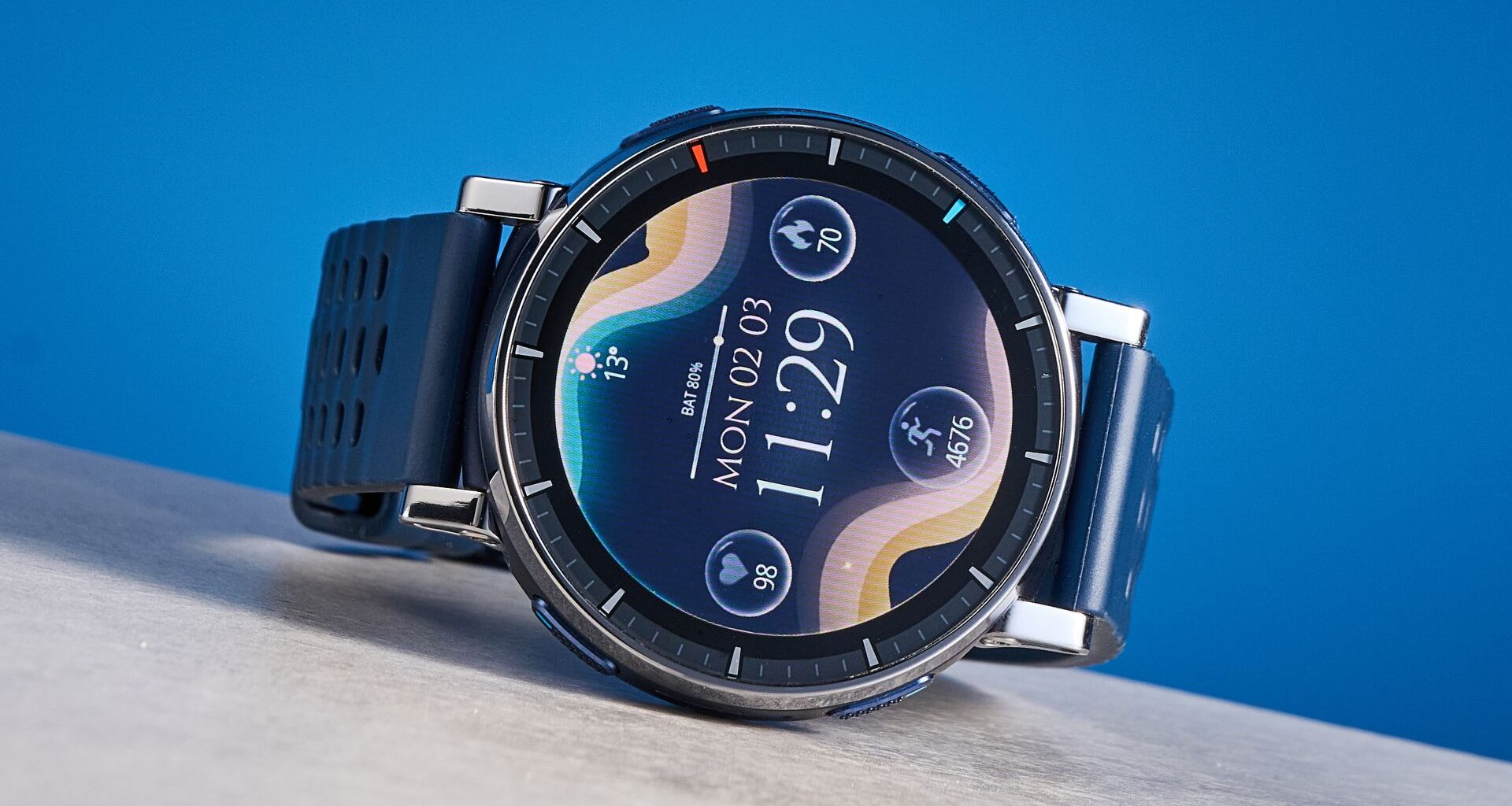 the amazfit active 3 premium photographed against the blue tom's guide background