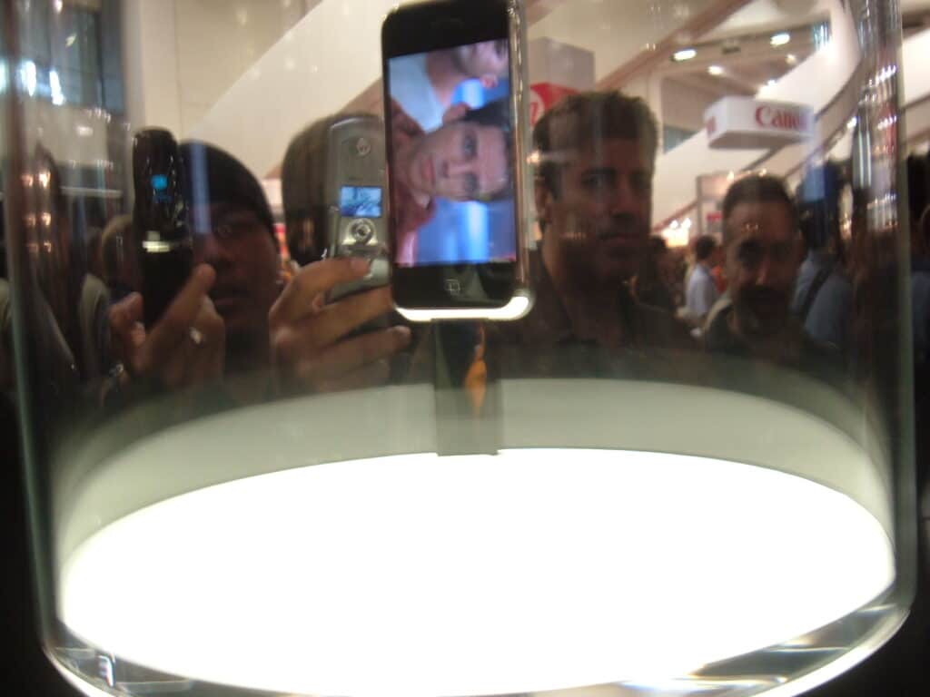 A woman paid $800 to be the first in line at the Apple store to snap up $100,000 worth of original iPhones to resell, but it turned out to be a costly mistake