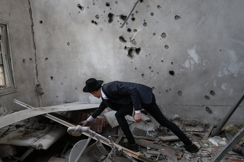 An ultra-Orthodox Jewish man assesses the damage inside a house following an Iranian strike over Bnei Brak in central Israel on March 31st, 2026. Photograph: Ilia YEFIMOVICH / AFP via Getty Images 