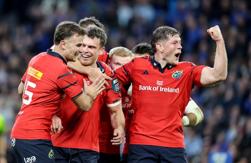 Munster's Shane Daly, Tom Farrell and Jack O'Donoghue celebrate a try against Leinster in the URC last October. Photograph: Dan Sheridan/INPHO
