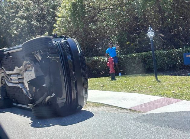 Tiger Woods taken to jail and charged with driving under the influence after rollover car crash in Florida