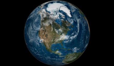 A view of Earth from space, with whisps of clouds drifting over the North American continent