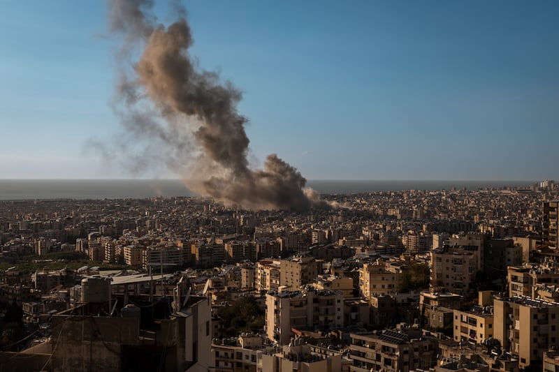 Smoke rises from an Israeli air strike in the suburbs south of Beirut, Lebanon, on Monday. Photograph: Diego Ibarra Sánchez/The New York Times
                      