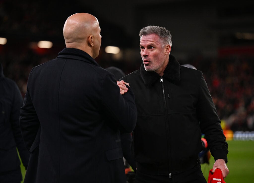 Jamie Carragher greets Arne Slot ahead of Liverpool's UEFA Champions League match against Paris Saint Germain at Anfield.