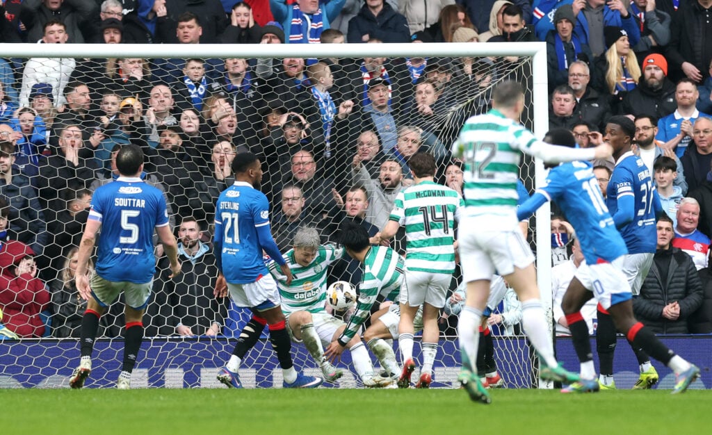 Reo Hatate of Celtic scores his team's second goal from a rebound after his penalty kick was saved by Jack Butland of Rangers