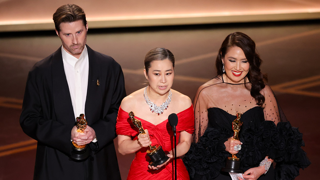 Chris Appelhans, Maggie Kang and Michelle Wong at the 98th Annual Oscars held at Dolby Theatre on March 15, 2026 in Hollywood, California.
