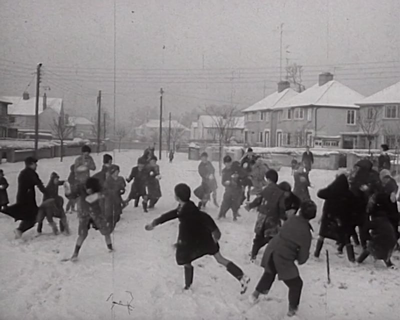 Children throwing snowballs during the big freeze of 1963. This still, from a film captured by Amharc Éireann, has now been digitised by the Irish Film institute (IFI).