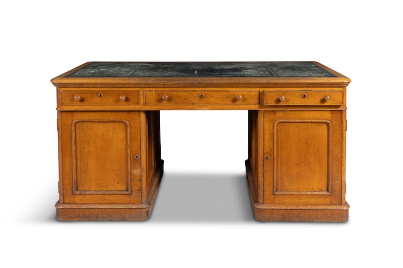A Victorian oak twin-pedestal writing desk