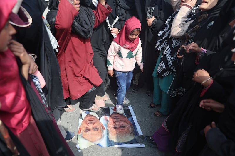 Shia Muslims in Budgam, India, trample over photographs of president Donald Trump and Israeli prime minister Binyamin Netanyahu during a protest against the killing of Iranian supreme leader Ayatollah Ali Khamenei
