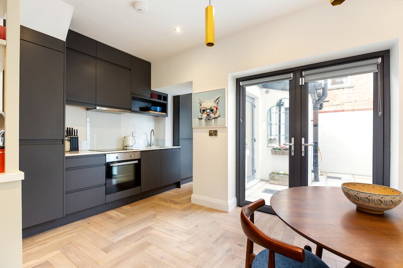 The courtyard is accessed from the kitchen/dining area