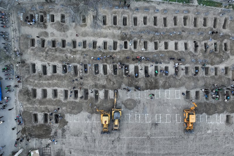 Mourners dig graves for children killed in a strike on a primary school in Iran's Hormozgan province in Minab on March 3rd. Photograph: Iranian Press Center/AFP via Getty Images