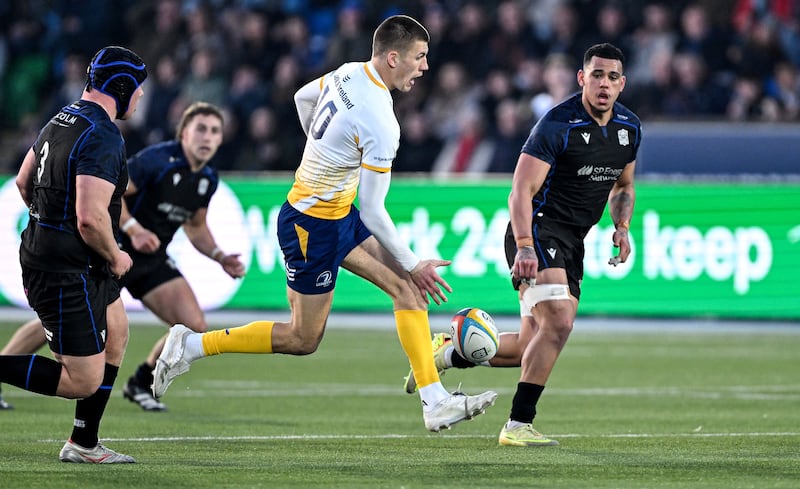 Leinster's Sam Prendergast chips the ball  during the game against Glasgow. Photograph: Craig Watson/Inpho