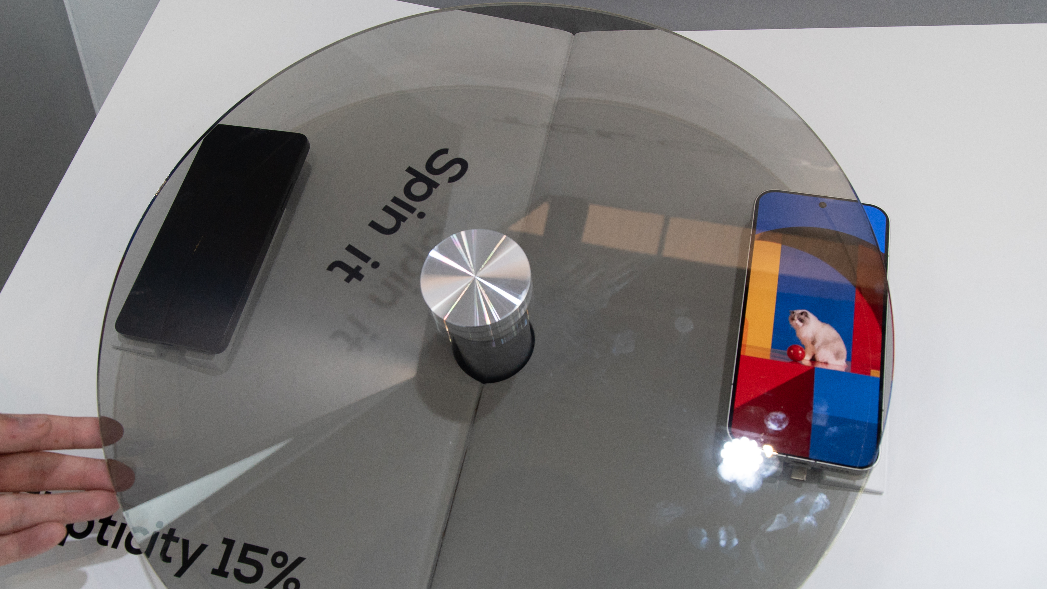 Two phones under a spinning panel