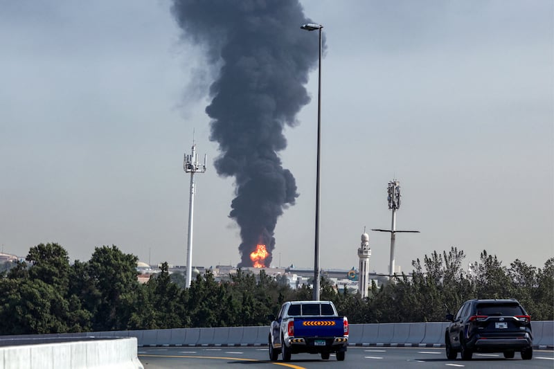 A smoke plume rises from a fire at Dubai International Airport on Monday. Photograph: AFP via Getty Images