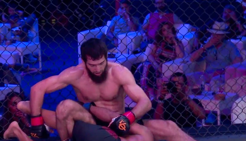 Christy Kinahan snr (right), wearing a blue shirt and Panama hat, attended a mixed martial arts event in Dubai last June. Photograph: Triller TV