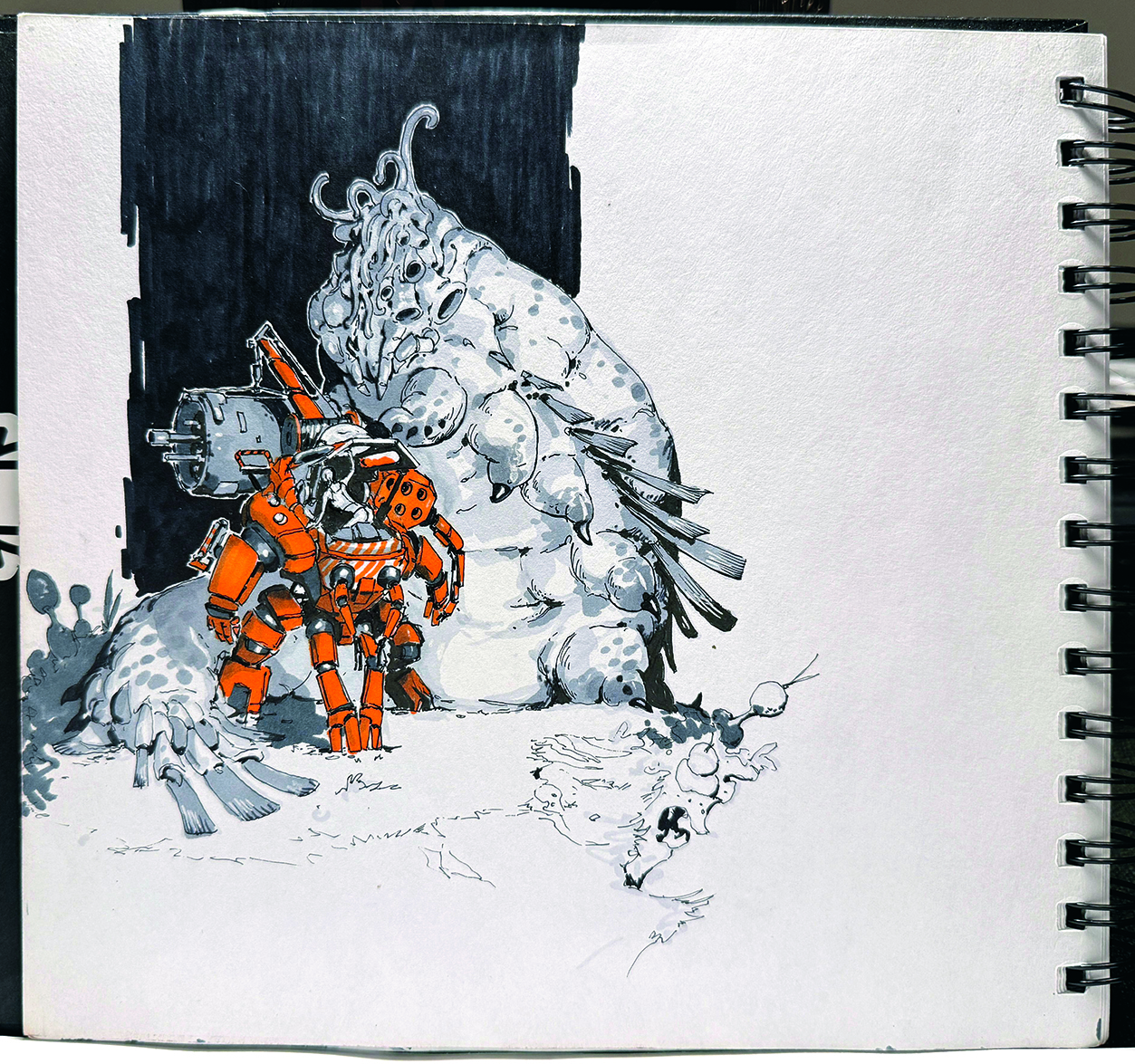A sketchbook page showing concept art of a mech and creature design