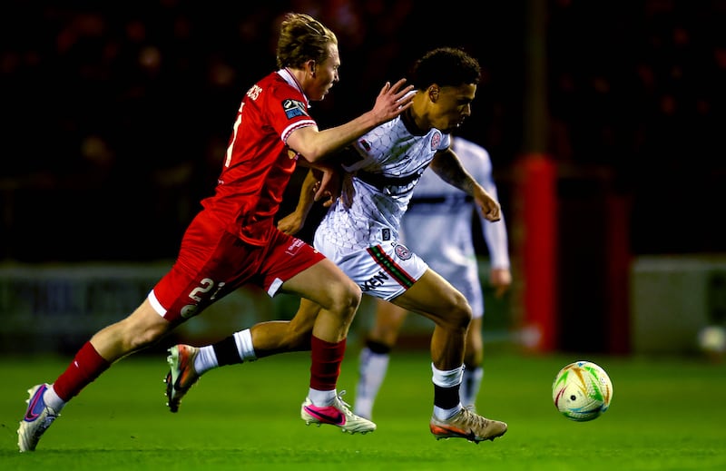 Zane Myers of Bohemians runs past Jack Henry-Francis of Shelbourne during the game at Tolka Park. Photograph: Ryan Byrne/Inpho