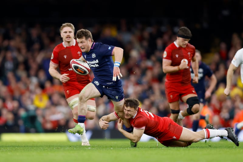 Scotland's George Horne is tackled by Wales' Jarrod Evans. Photograph: Nigel French/PA