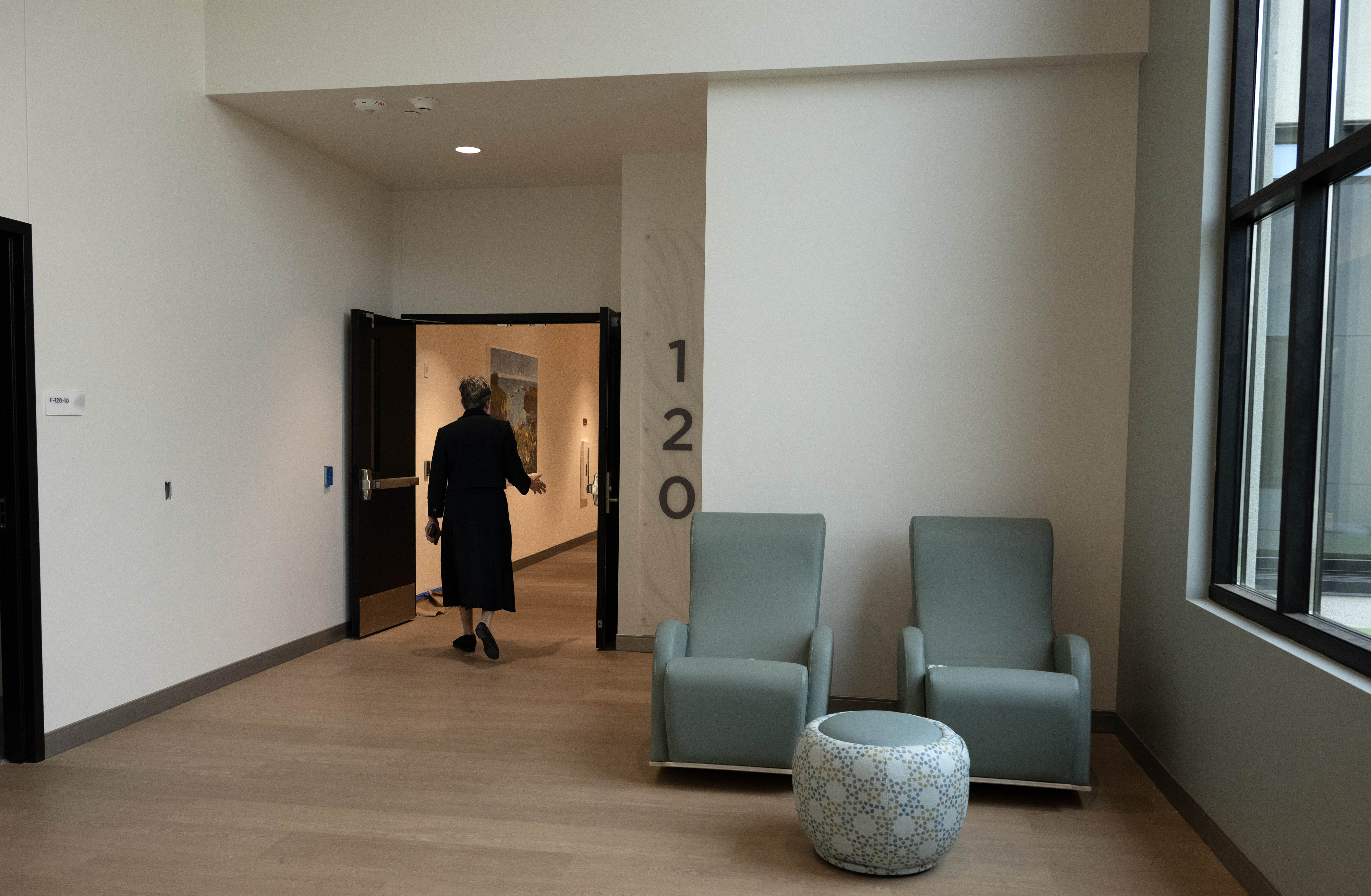 Blair Contratto, chief strategy officer for Be Well OC, walks...