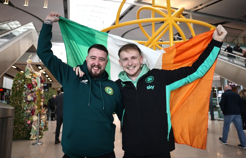 Brendan Gilsenan and Oisin Terrell, Mullingar, were among the Ireland fans leaving Dublin Airport on Wednesday. Photograph: Dara Mac Dónaill