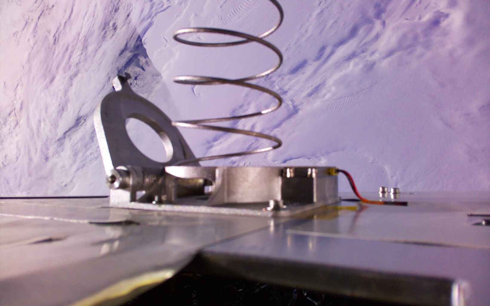 The 3D-Printed titanium spring deployed aboard the Mercury One spacecraft in orbit. Credit: Proteus Space