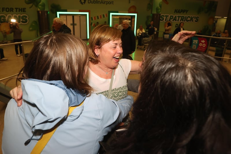 Colette Cummins is greeted as she arrives at Dublin Airport on a flight from Dubai on Thursday. Photograph: Liam McBurney/PA