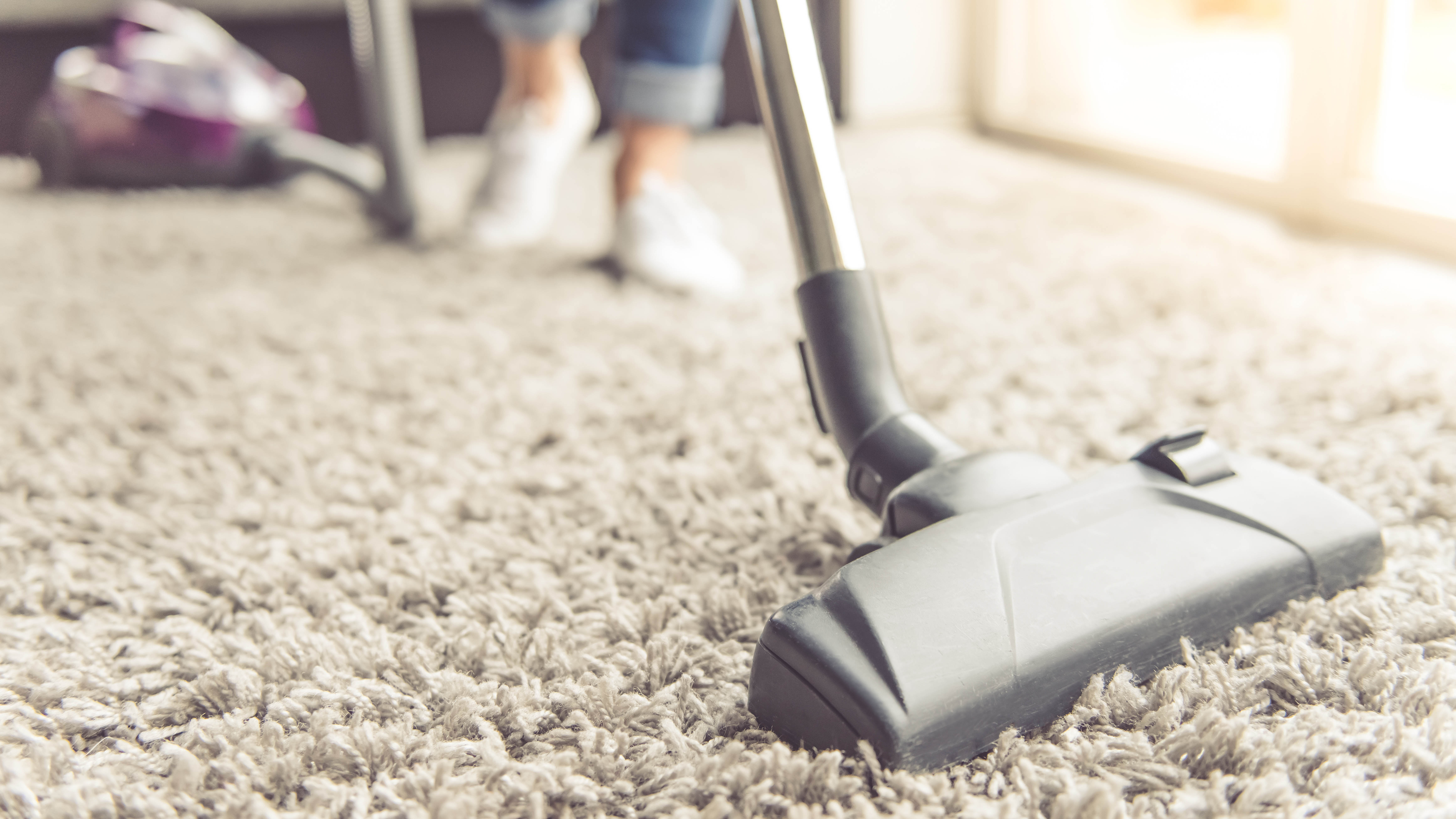 Vacuuming carpet